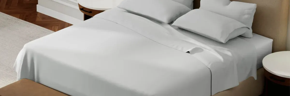 Purecare Cotton Sheets on a made bed in a modern bedroom setting.